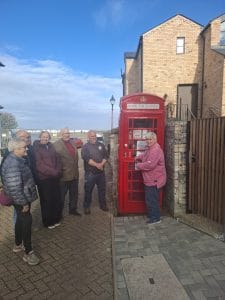 The restored red telephone kiosk book exchange on Pier Road, Greenhithe, at its opening on 28 October 2026