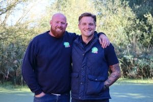 Everyday Play founders Luke Savage and Lewis Walsh standing outdoors in company clothing