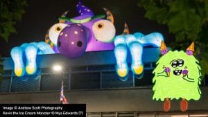 Giant inflatable monster on a Maidstone building beside the Kevin the Ice Cream Monster mascot drawing