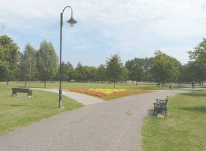Paths, benches and a flower bed in Victoria Park, Ashford