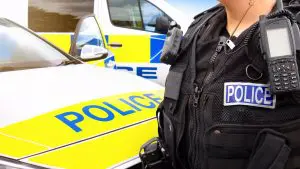 Police officer with radio and vest