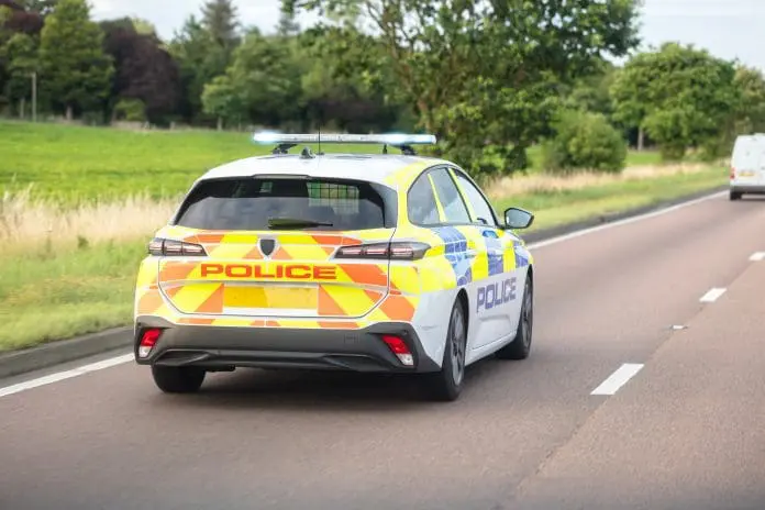 Police,Siren,Flashing,Blue,Lights,Driving,On,Motorway,To,Accident