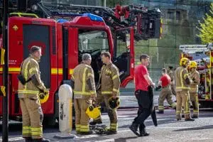 Fire crew with helmets at emergency scene