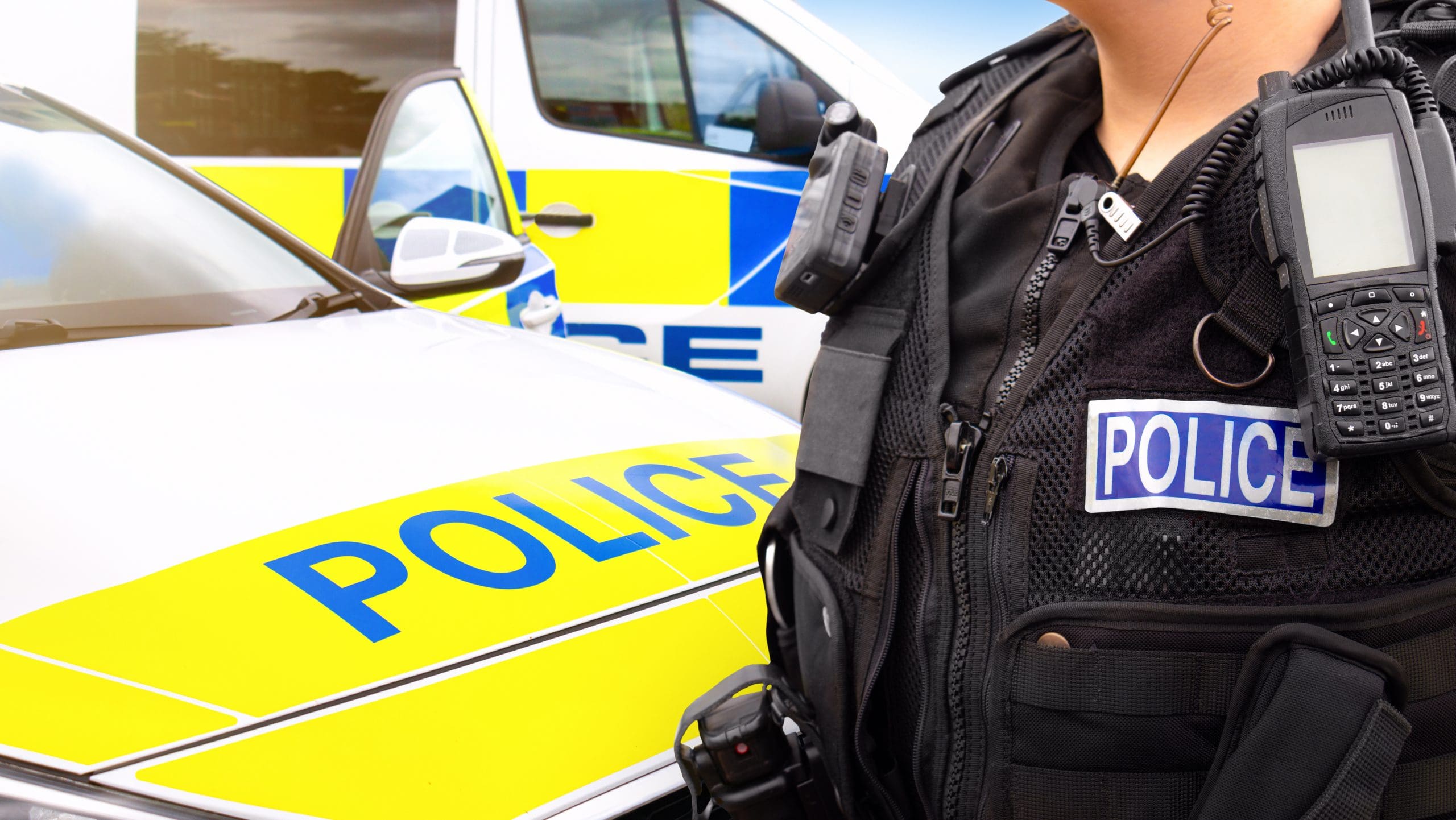 Police officer with radio and vest