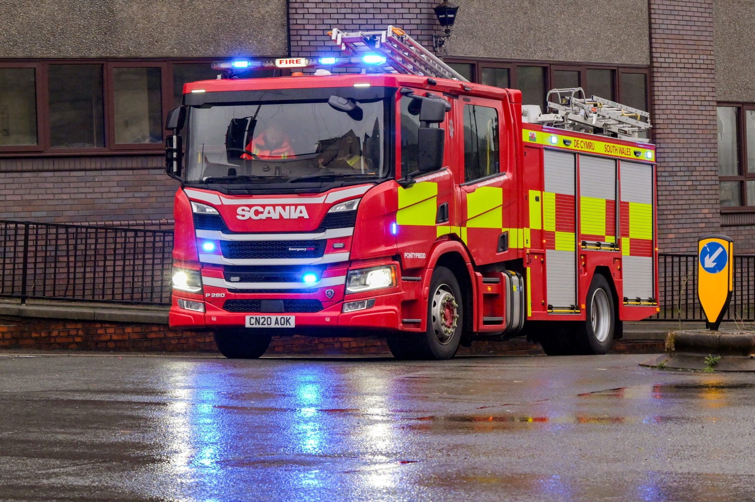Fire engine responding in rain at night